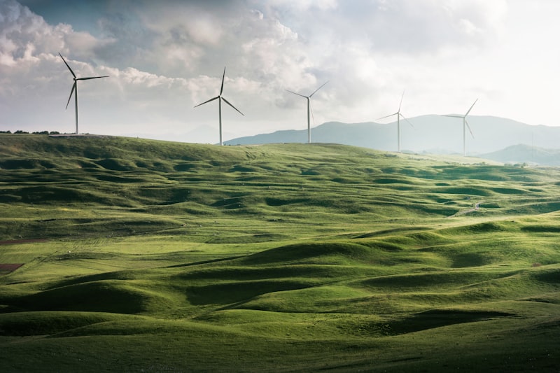 Wind turbines on a green hill in Galicia
